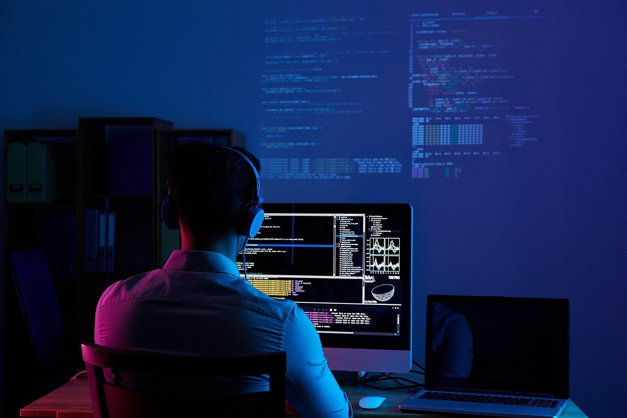 Illustrated portrait of Ethan Lain in a modern developer workspace